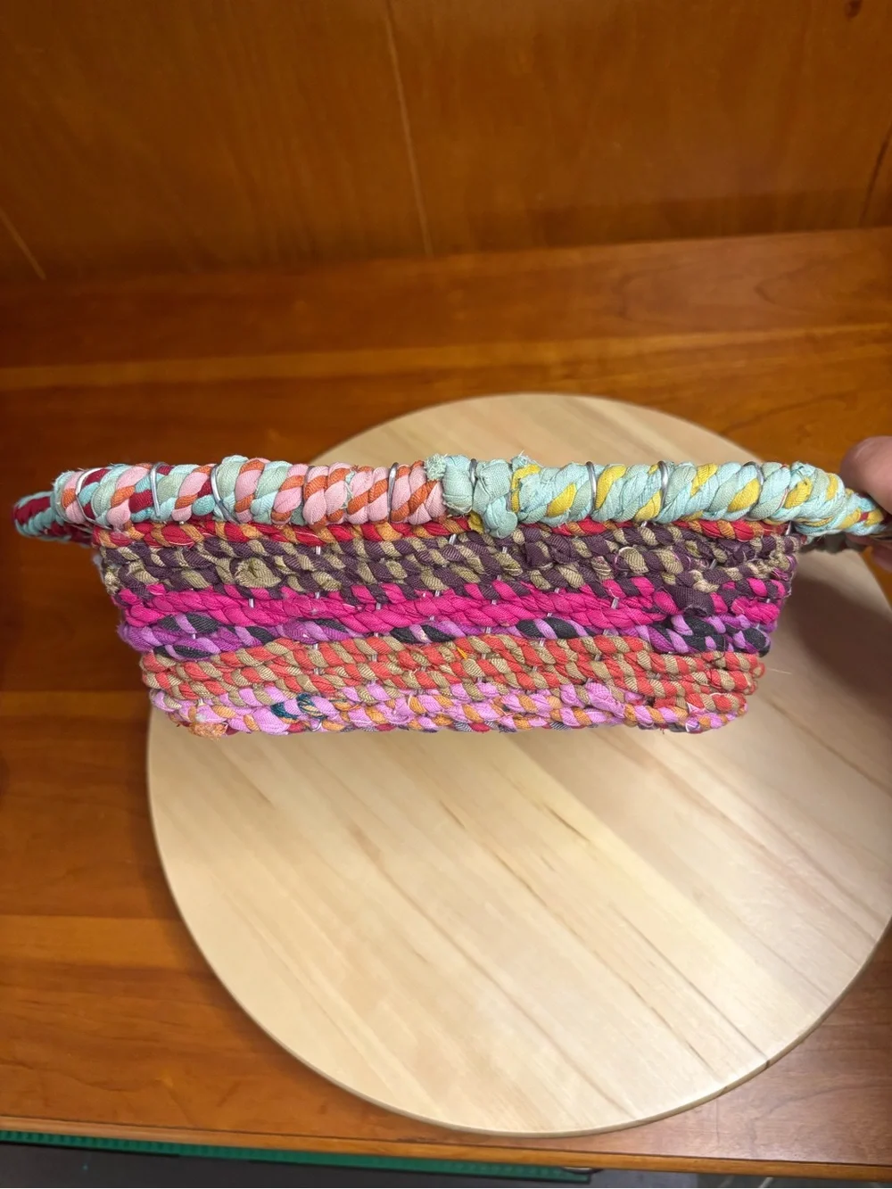 handcrafted square storage basket featuring vibrant concentric rings